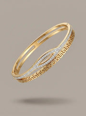 Gold Greek key bangle with pave zircon marquise centre