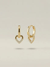 Gold plated huggie hoops with open heart drop charms edged in clear crystals