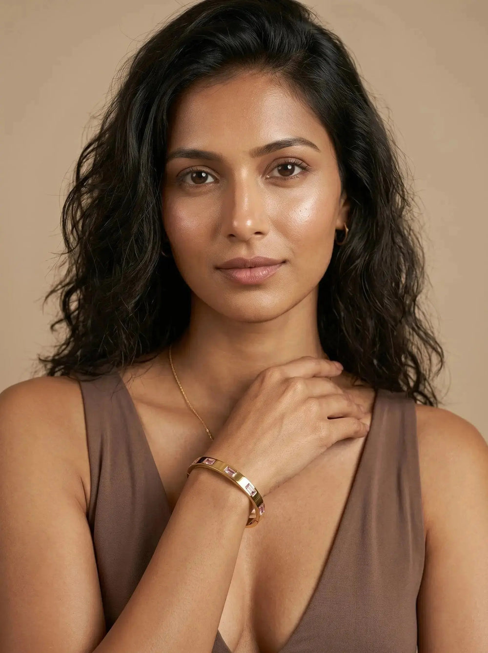 Gold bangle set with pink baguette cut zircon stones — view 2