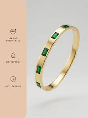 Gold bangle set with green baguette cut zircon stones — view 4
