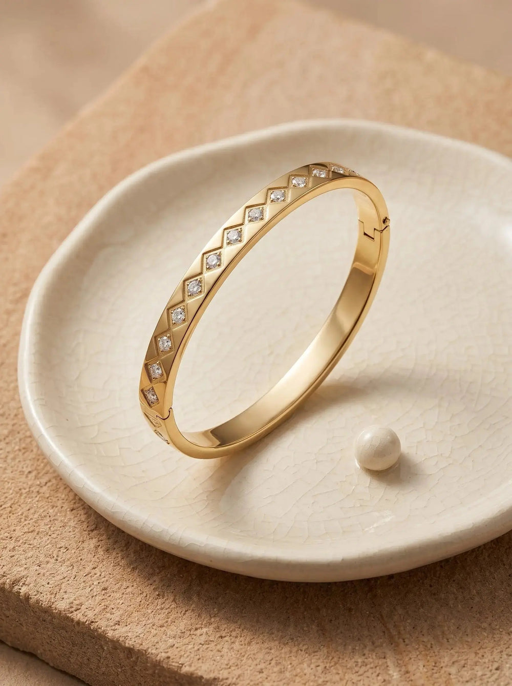 Gold bangle with clear zircons in rhombus shaped settings — view 5
